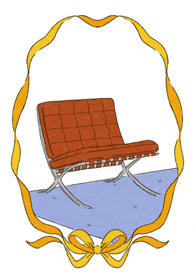 Brown leather chair reflected in decorative mirror with yellow ribbon