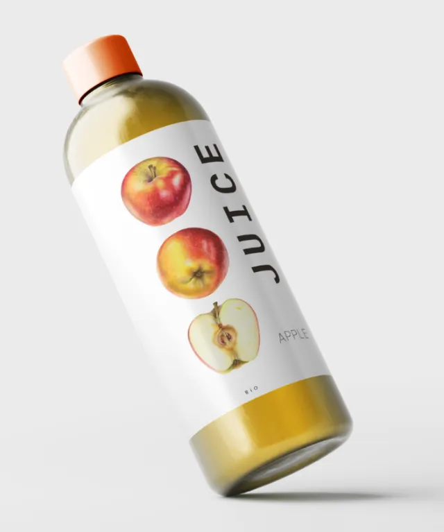 Bottle of apple juice with label showing apples and text