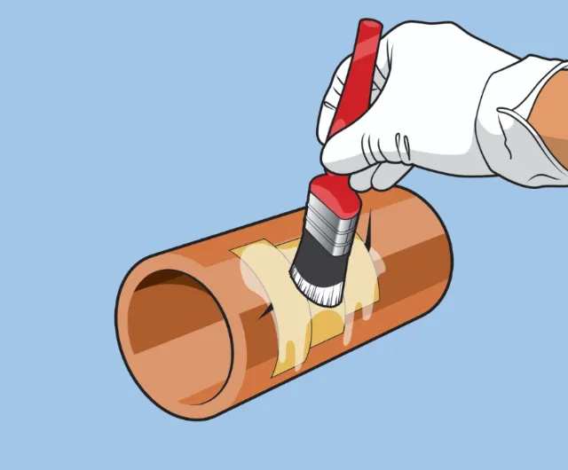 Gloved hand painting brown pipe section with red brush by Lee Montgomery