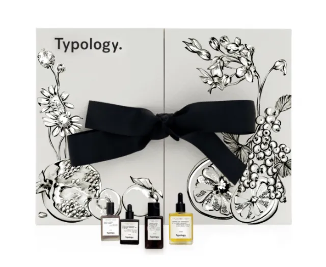 Typology skincare bottles with black ribbon and floral illustrated box by Elly Azizian