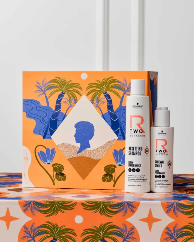 Hair care shampoo and conditioner bottles with tropical artwork by Gina Rosas Moncada