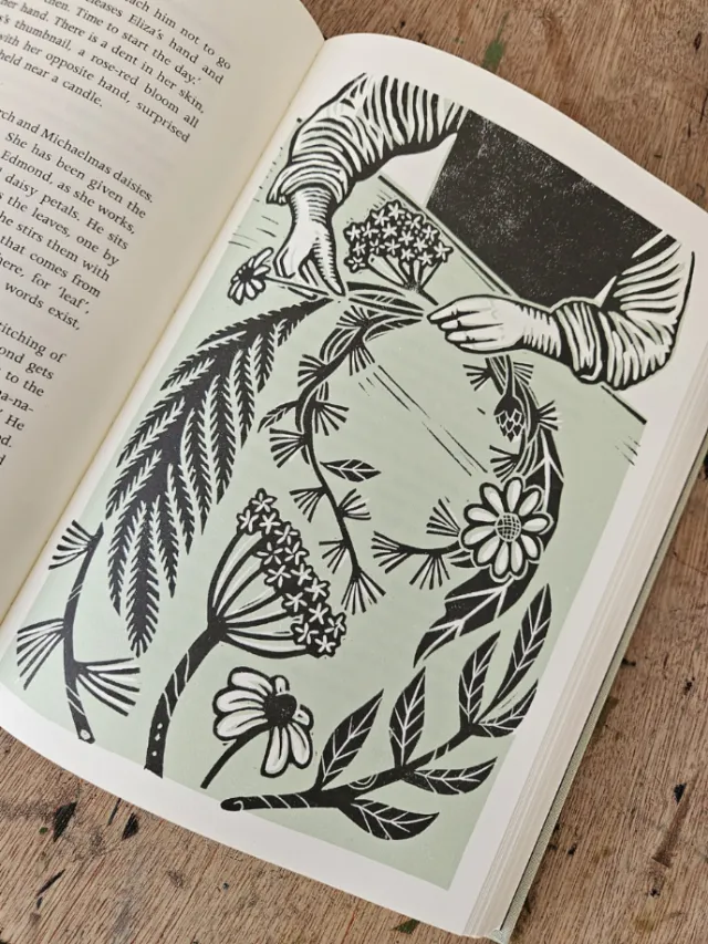 Linocut illustration of hands creating a flower crown by Becca Thorne