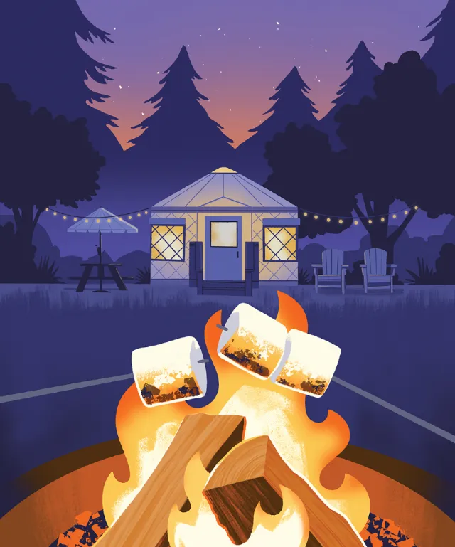 Campfire with toasted marshmallows near yurt and garden lights at sunset by Drew Bardana