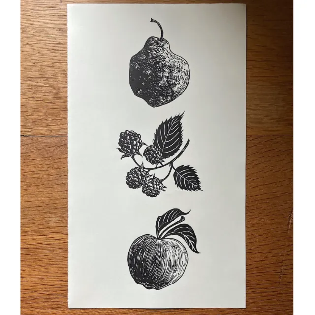 Lino print of a pear, blackberries, and an apple by Emily Robertson