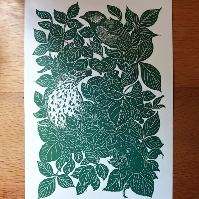 Lino cut of song thrush, great tit, and mouse in leafy hedgerow by Emily Robertson