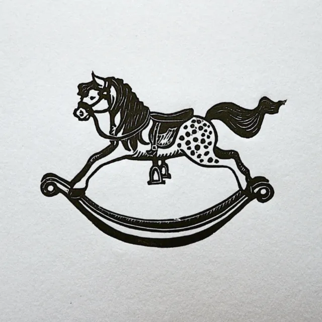Lino cut print of a rocking horse by Emily Robertson
