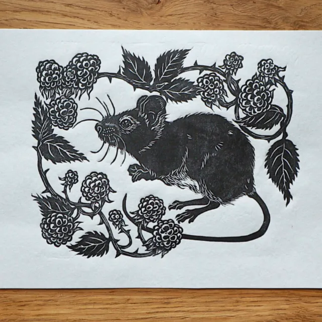 Black and white lino cut of a mouse with blackberries by Emily Robertson