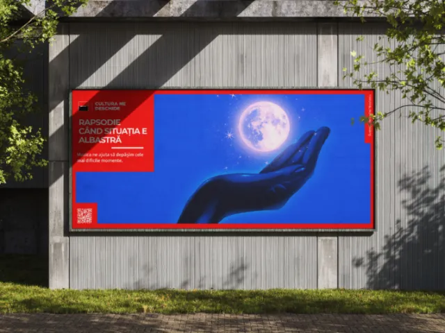 Billboard with hand holding full moon artwork by Andrei Nicolescu