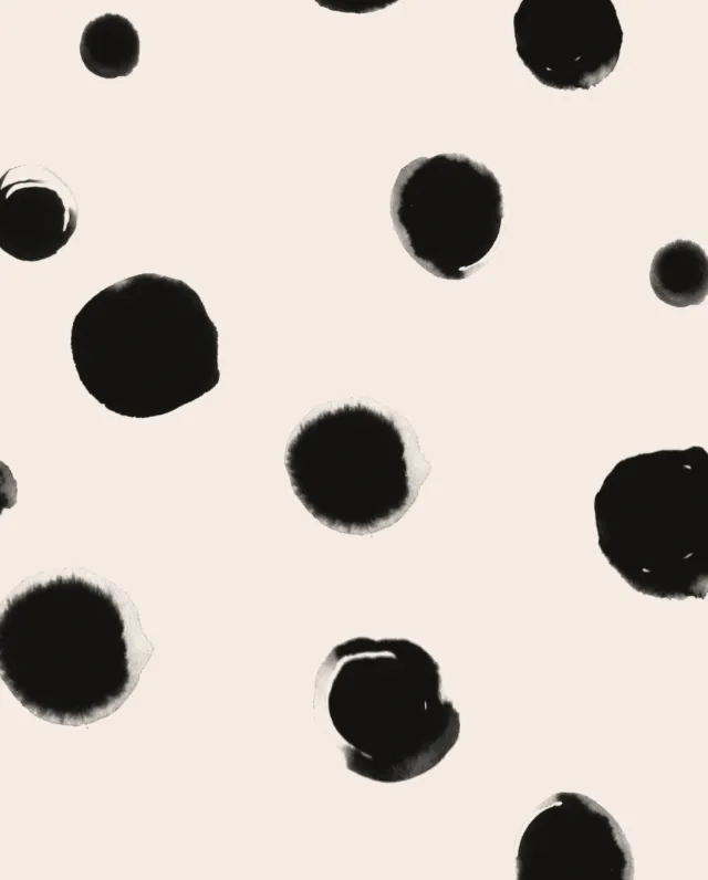 Abstract black ink blot pattern on beige background by Nadia Flower