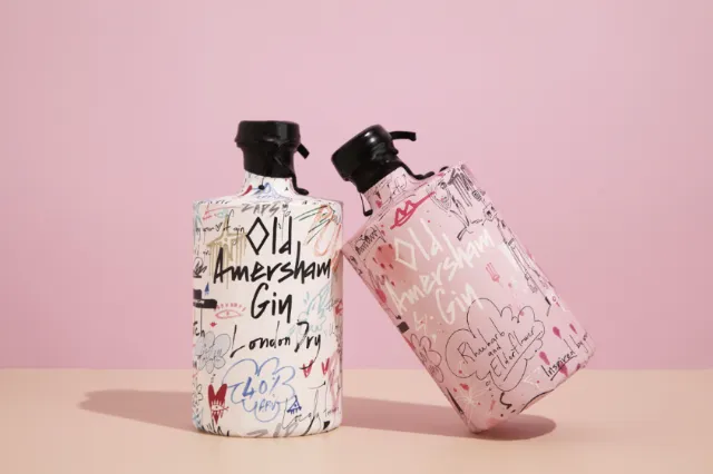 Two artistic gin bottles with handwritten designs by Nadia Flower