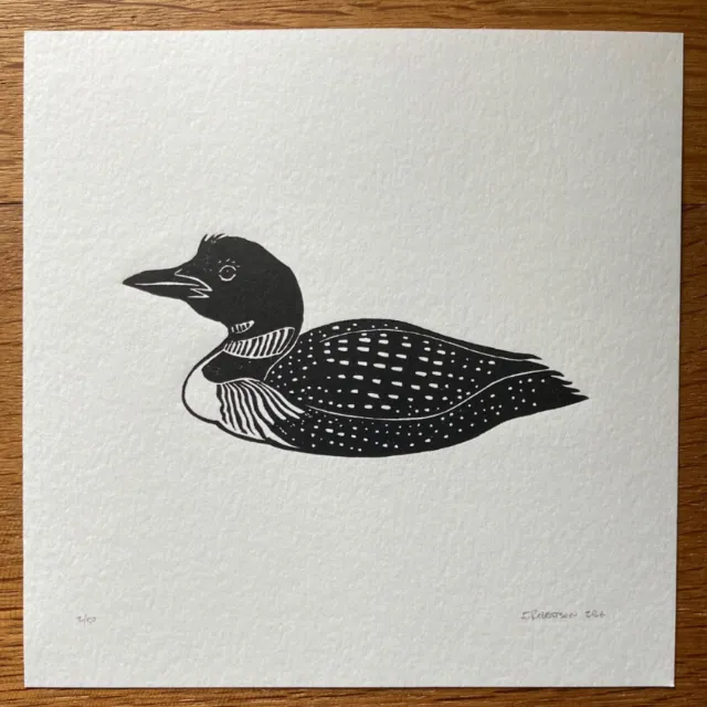 Black and white lino cut print of a loon bird by Emily Robertson