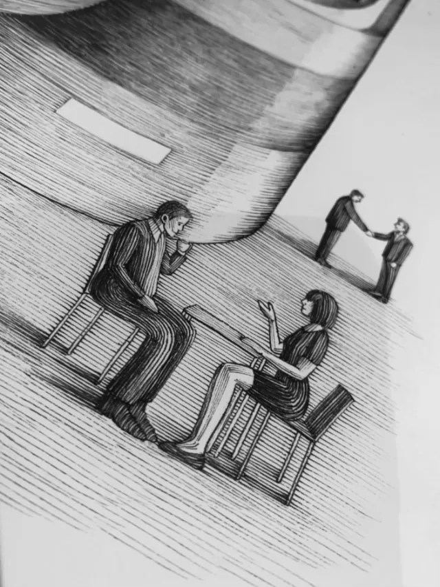 Two people sitting and talking with two others shaking hands in background by Miosis