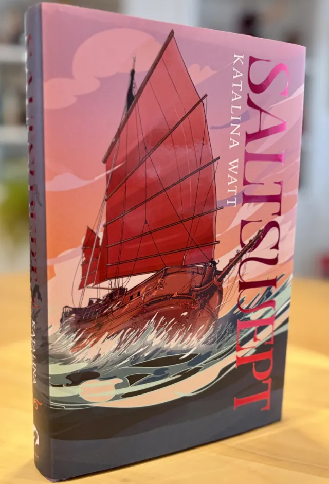 Book cover of Saltswept with red sailboat on waves by Carolina Rodriguez Fuenmayor