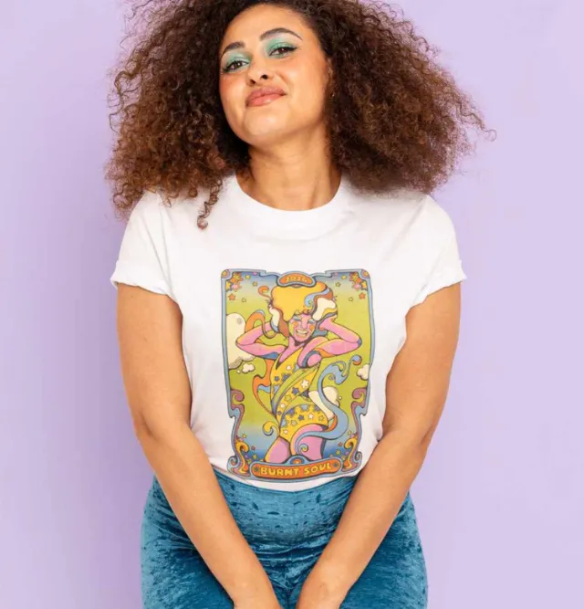 Woman wearing a Burnt Soul festival t-shirt with psychedelic design by Laura Greenan