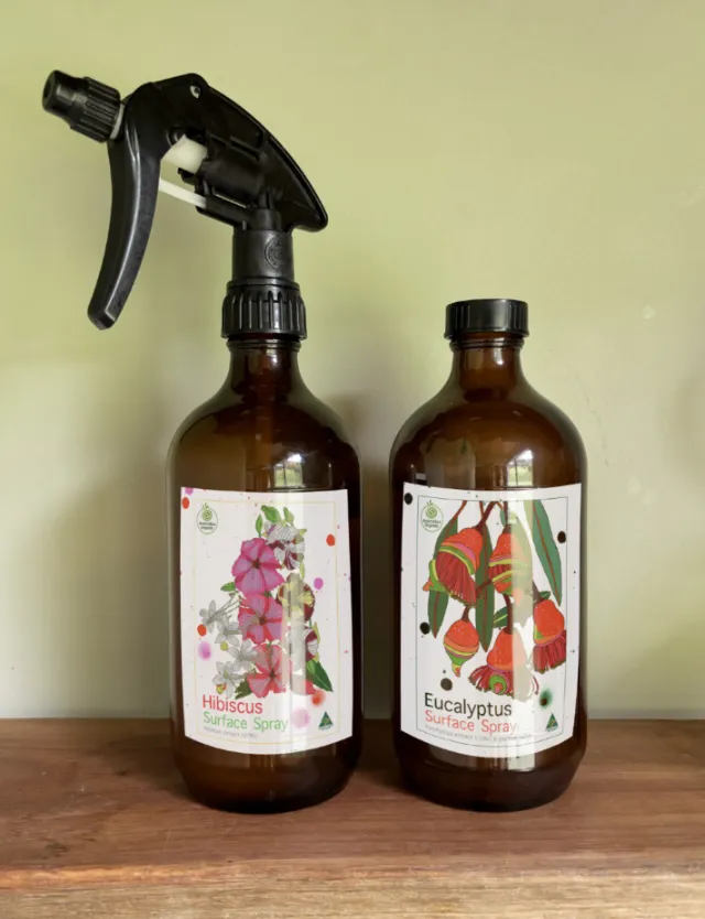 Spray bottles with hibiscus and eucalyptus labels by Sarah Beetson