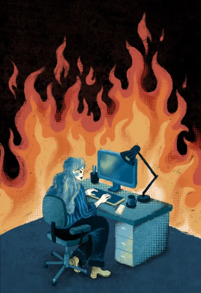 Person working at computer desk with flames in background by Alyssa De Asis