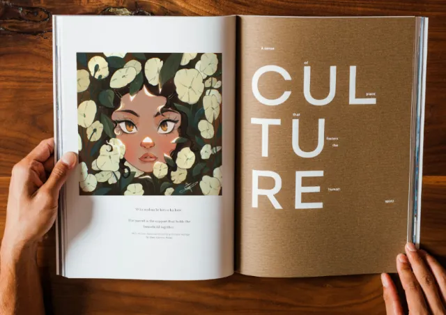 Hands holding an open book with an illustration and the word CULTURE, artwork by Danielle Pioli