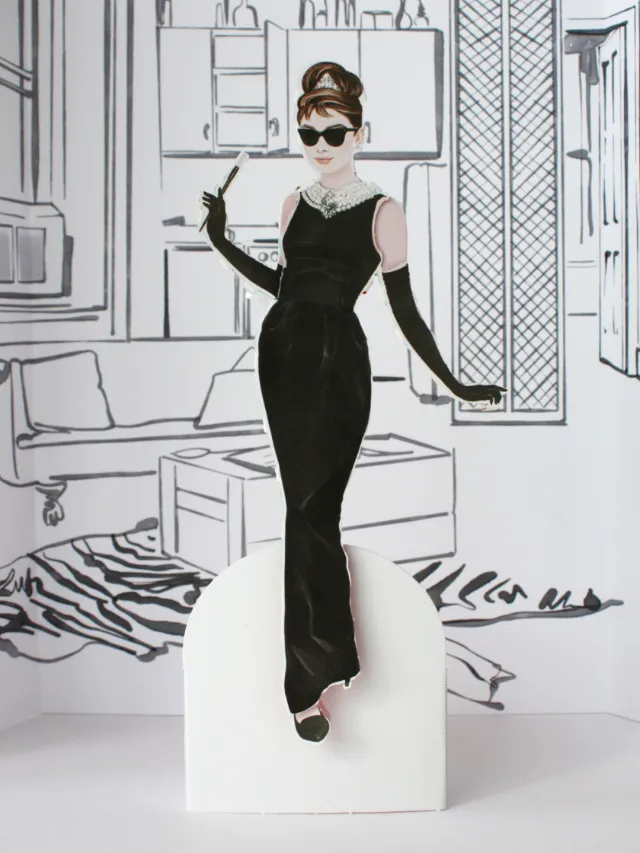 Illustration of Audrey Hepburn paper doll in black dress by Kelly Smith