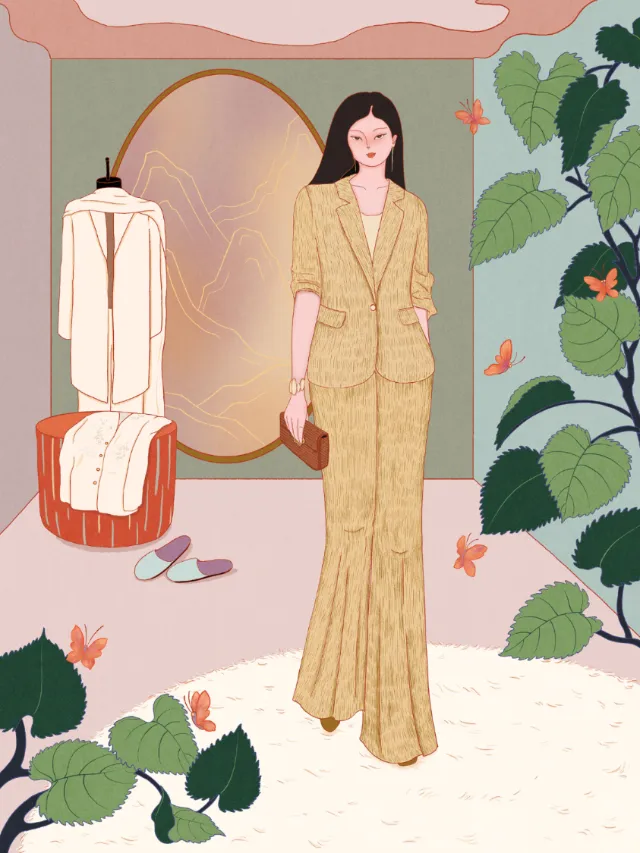 Woman in yellow suit standing indoors with plants and mirror by Leah Han