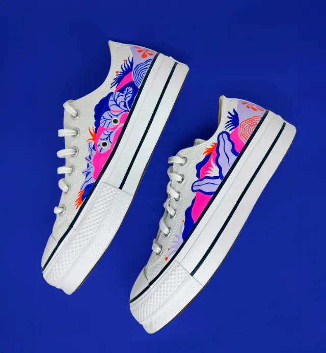 White canvas sneakers with colorful floral and bird designs by Gina Rosas Moncada
