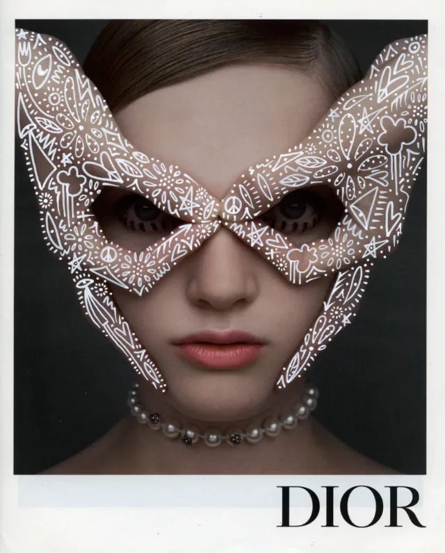 Portrait of woman with Dior face mask and pearl necklace by Nadia Flower