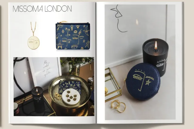 Missoma London jewelry and candles displayed with necklace and pouch by Nadia Flower
