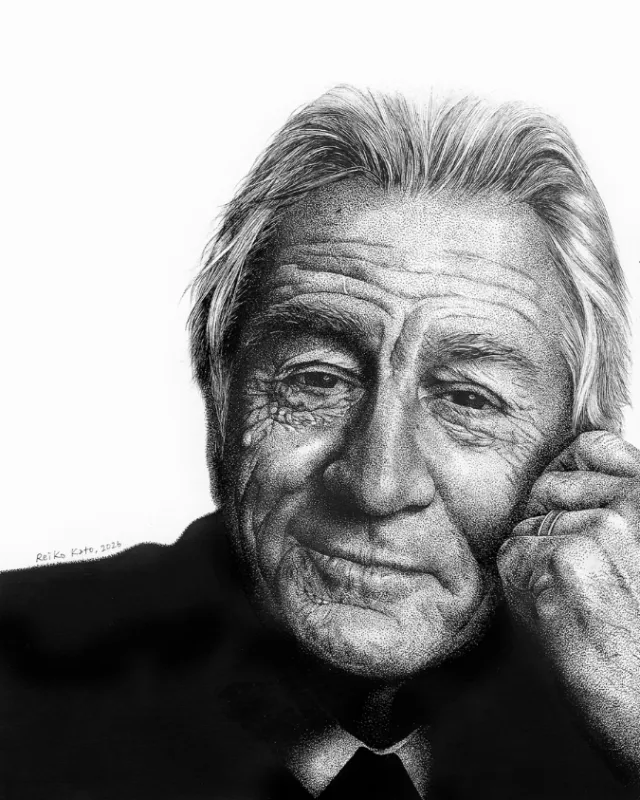 Black and white portrait by Reiko Kato of a smiling older man