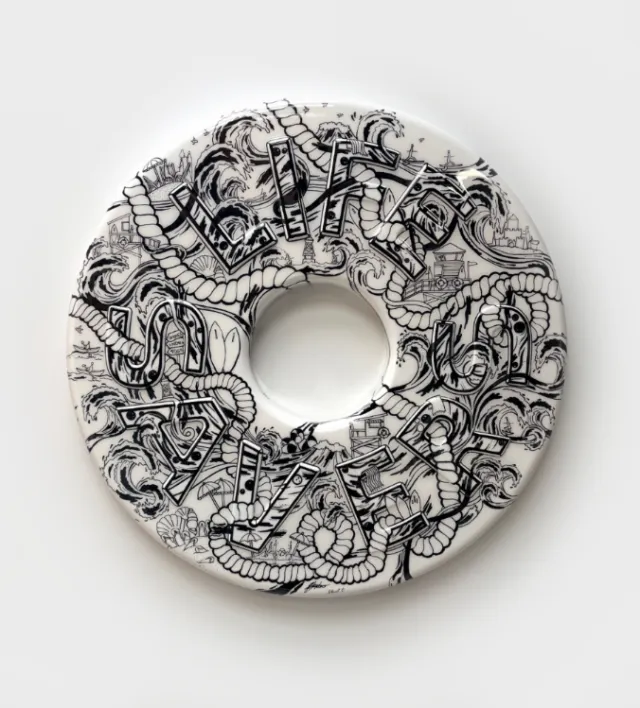Ellie Compton's illustrated lifesaver sculpture covered in intricate black-and-white drawings