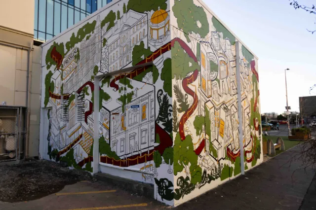 Architectural history mural by Ellie Compton covering two walls in a laneway