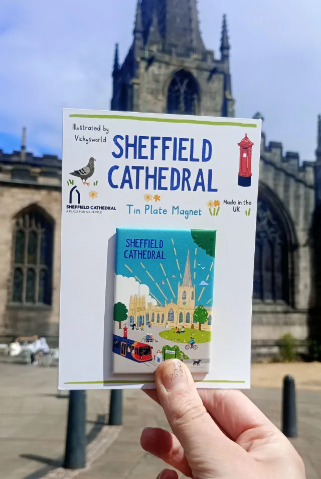 Vicky Scott’s Sheffield Cathedral tin plate magnet held before the cathedral