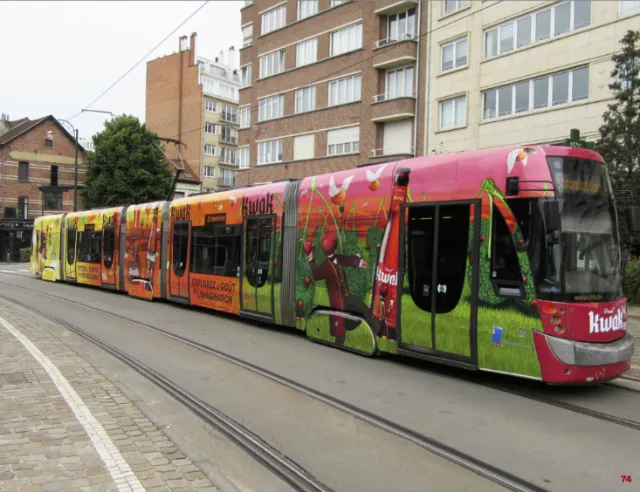 Colorful tram on urban tracks by Bob Venables