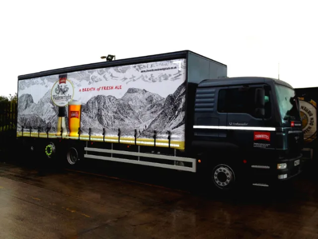 Bob Venables artwork showing a black truck with a mountain mural.