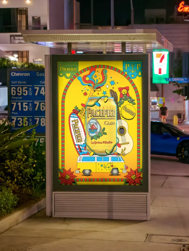 Colorful arcade game poster beside a gas station, photographed by Season of Victory.