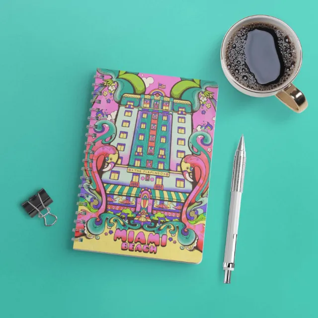 Laura Greenan's colorful Miami Beach notebook beside coffee and pen