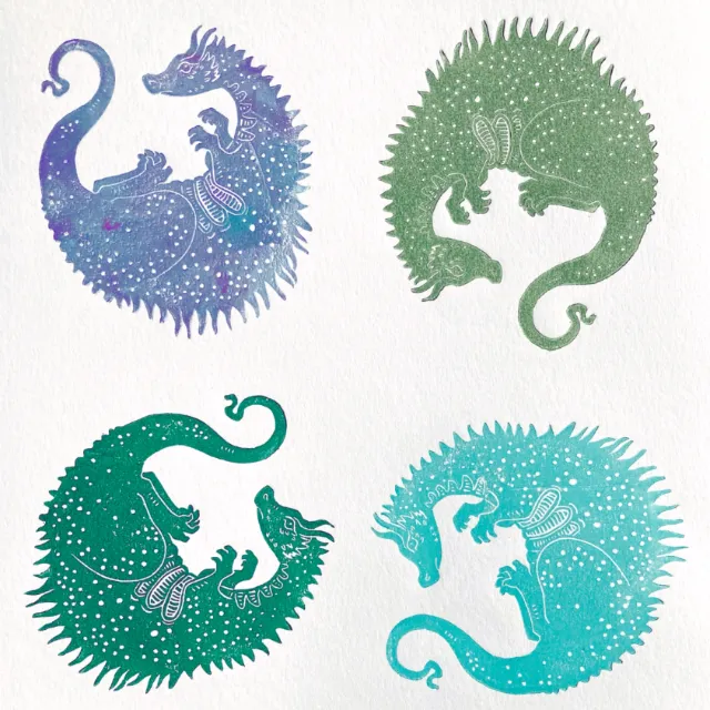 Emily Robertson's four coloured dragon linocut prints