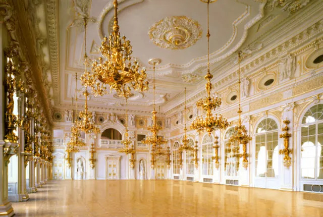 Ornate Baroque ballroom interior with gold chandeliers and decorated ceiling by Eberhard Reimann