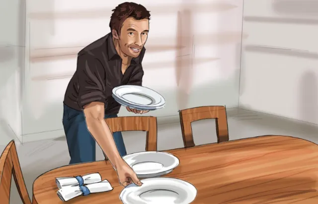 Man setting plates on table by Björn von Schlippe