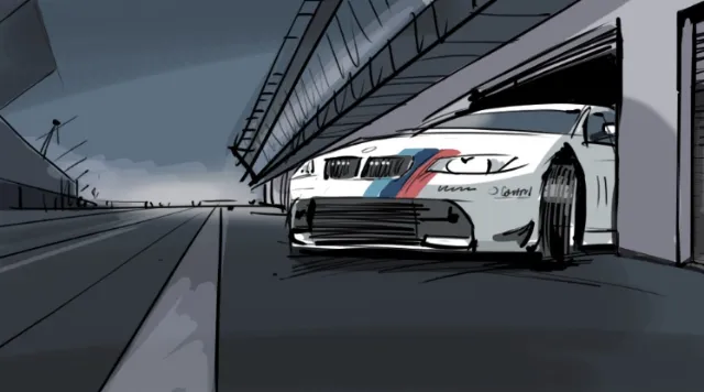 Race car parked in garage at racing track by Björn von Schlippe