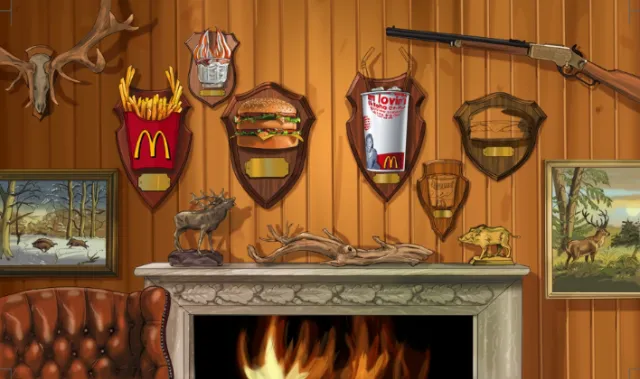 Fast food trophies mounted on wooden wall above fireplace by Björn von Schlippe
