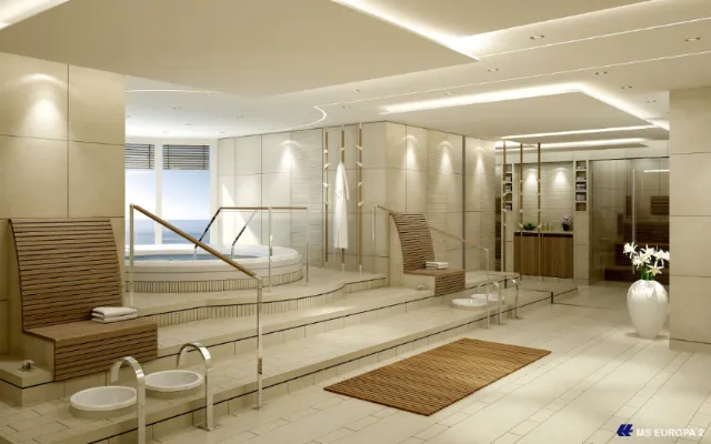 Modern spa interior with hot tub and lounge chairs by Oliver Hasselluhn