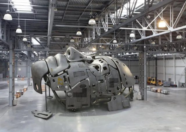 Metal industrial sculpture inside warehouse by RIVE GAUCHE