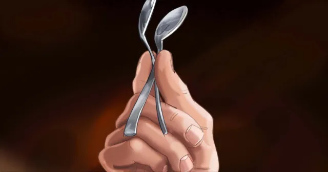 Hand bending two metal spoons, artwork by Björn von Schlippe