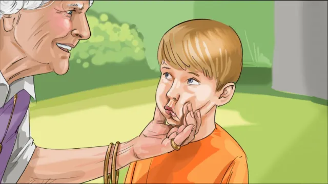Older man gently comforting young boy outdoors by Björn von Schlippe