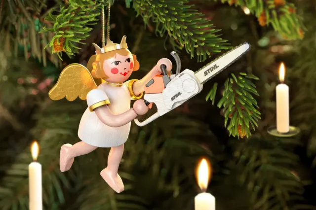 Wooden angel ornament with a chainsaw on Christmas tree by RIVE GAUCHE