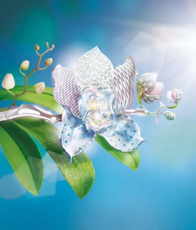 Glass orchid sculpture on a branch with green leaves under bright sunlight by Tom Krieger