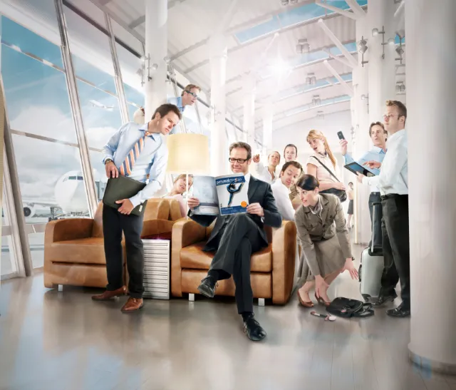 Office meeting with diverse employees working and discussing, by Tom Krieger