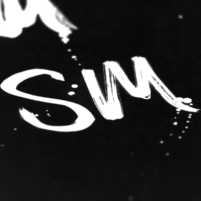 Lettering SM in white